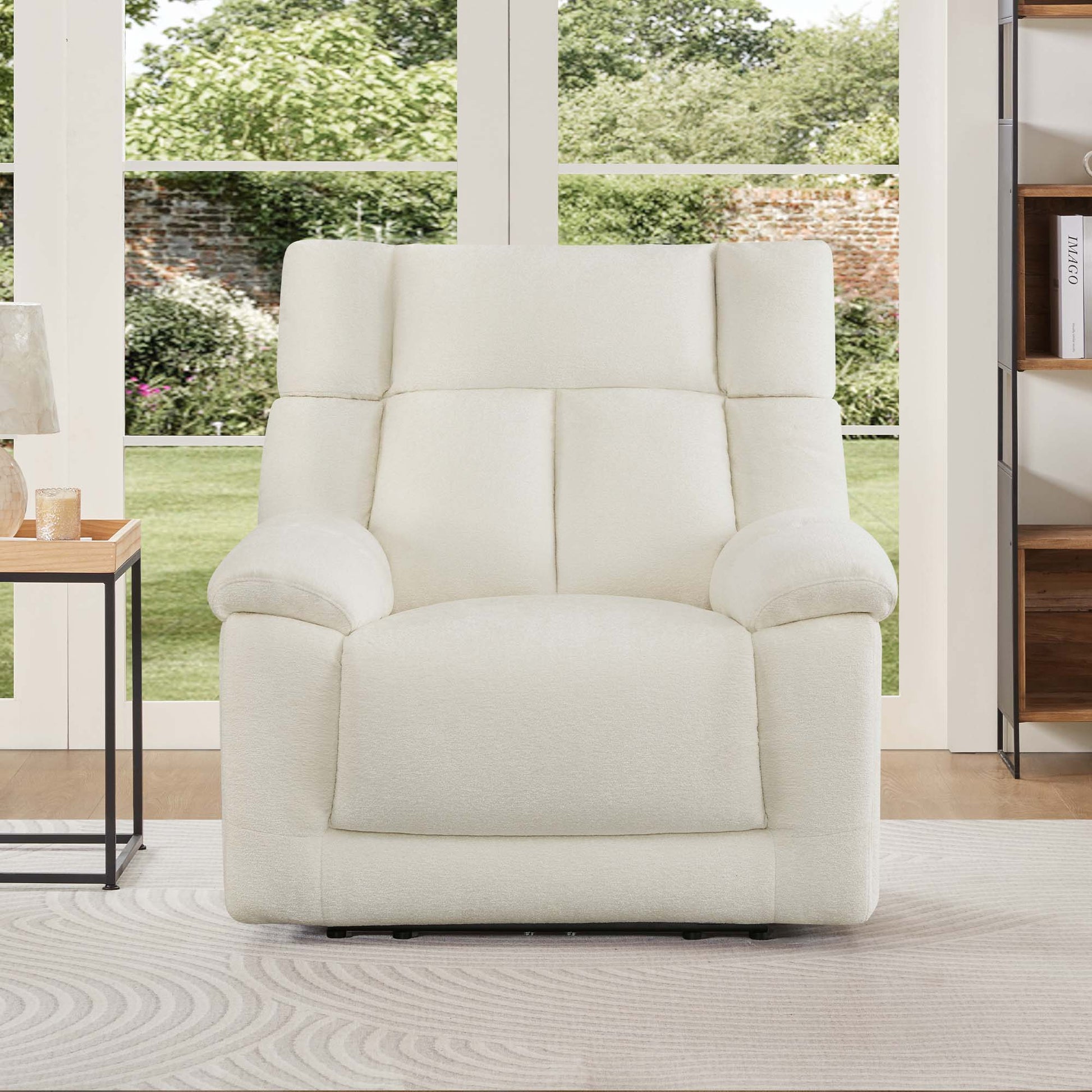 The Sonia Recliner, in cream fabric, features Bluetooth speakers and power lumbar support for ultimate comfort.