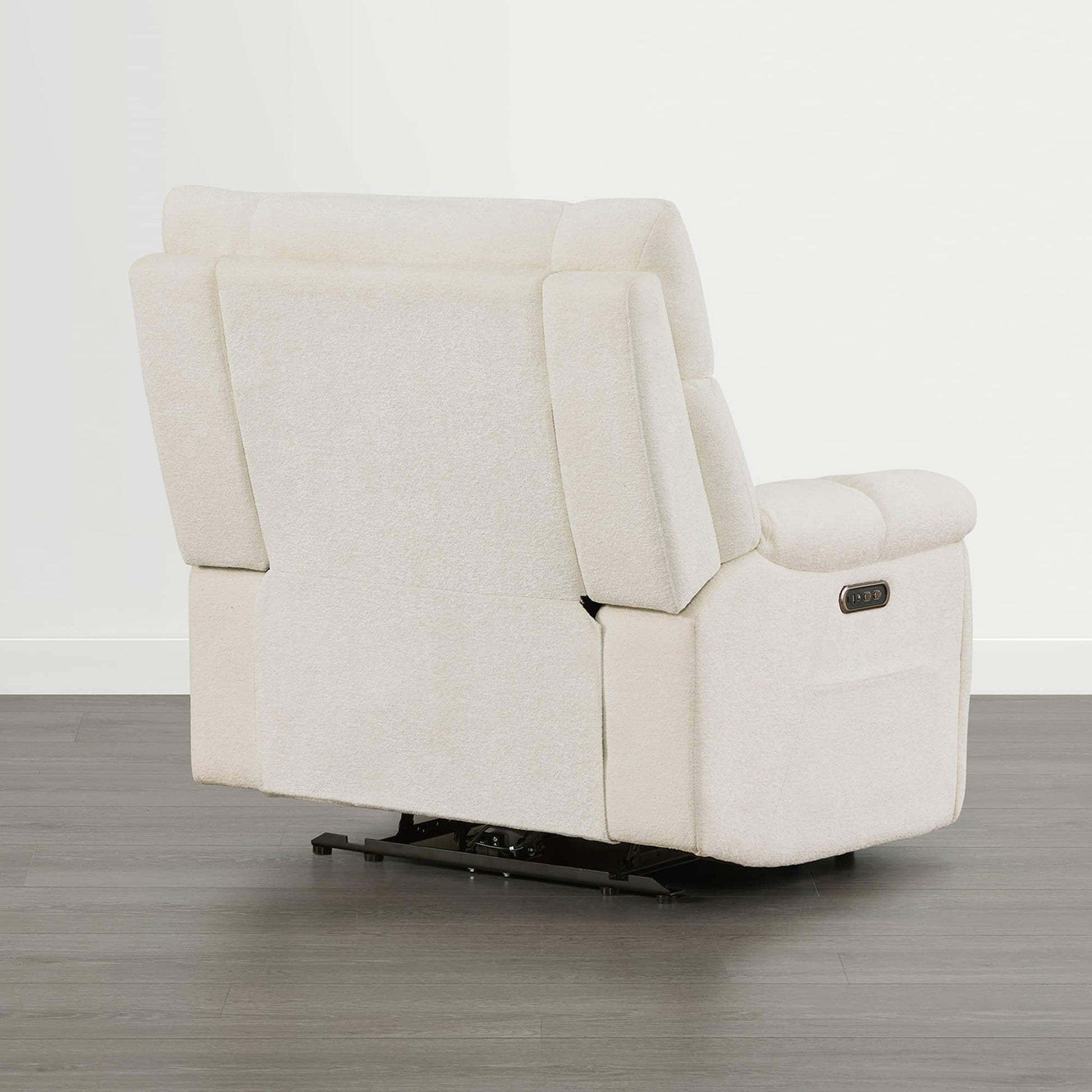 The Sonia Recliner, in cream fabric, features Bluetooth speakers and power lumbar support for ultimate comfort.