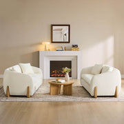 Cream modern sofas with wood accents in a stylish living room setup.