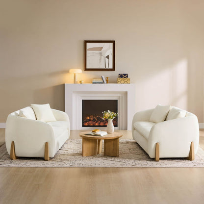 Cream modern sofas with wood accents in a stylish living room setup.