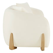Side view of a modern sofa with curved design, cream upholstery, and wooden legs