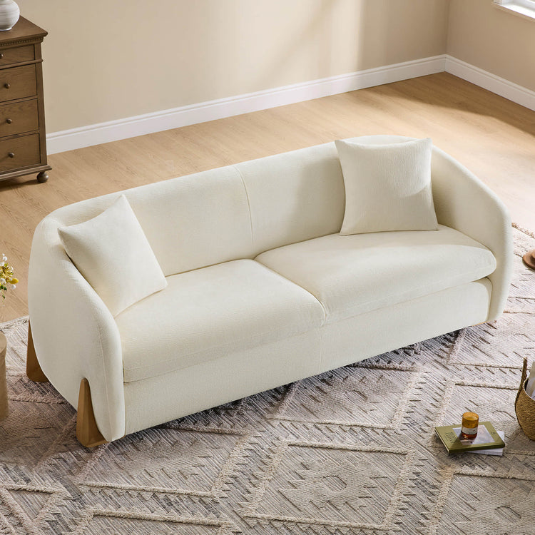 Overhead view of a chic, cream-colored sofa with a contemporary design.
