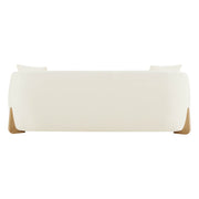Sleek modern sofa with wood accents, minimalist design