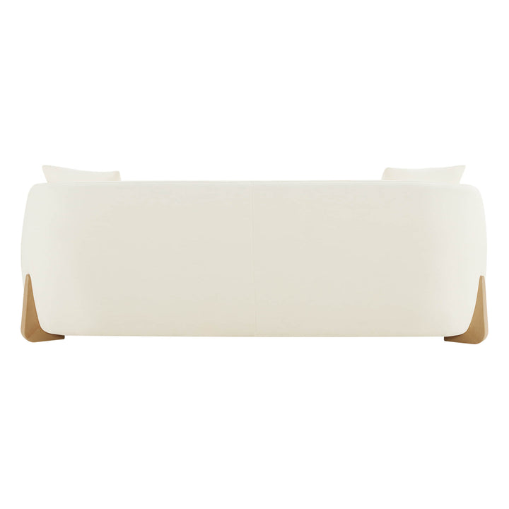 Sleek modern sofa with wood accents, minimalist design