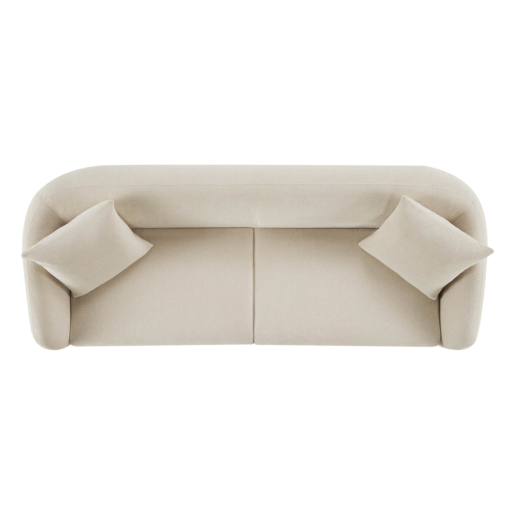 Top view of a modern cream sofa with a rounded back and two cushions.