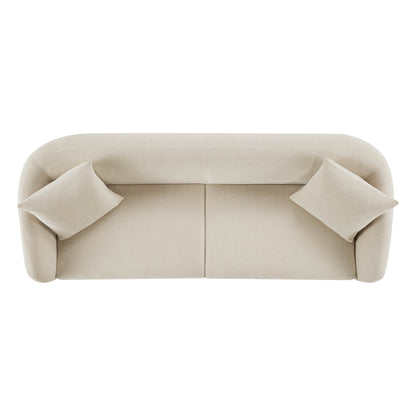 Top view of a modern cream sofa with a rounded back and two cushions.