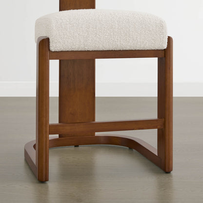 Troy Boucle Counter Stools with solid wood frames and cream bouclé upholstery provide a stylish, modern seating option.