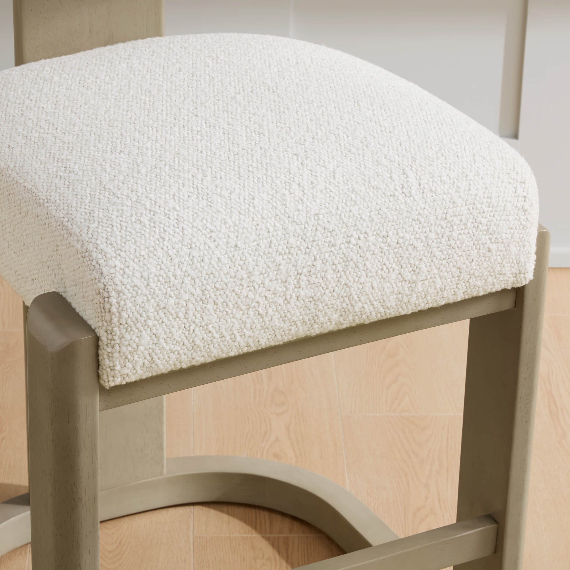 Troy Boucle Counter Stools with solid wood frames feature a plush white bouclé seat for modern comfort.