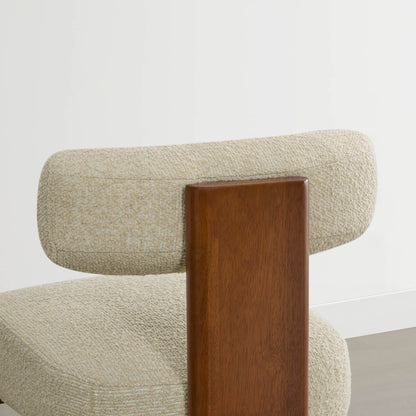 Troy Boucle Counter Stools with solid wood frames and beige bouclé upholstery offer a modern, stylish seating option.