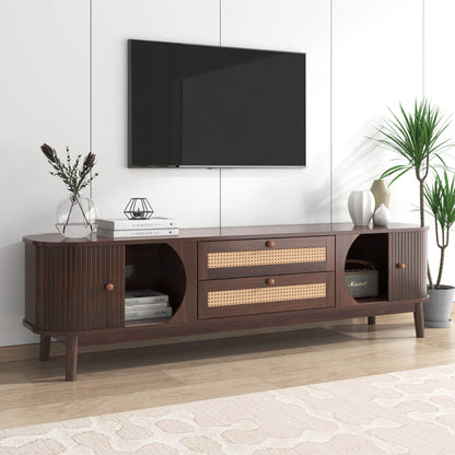 Modern tv stand dark wood with rattan drawers in a bright living room.