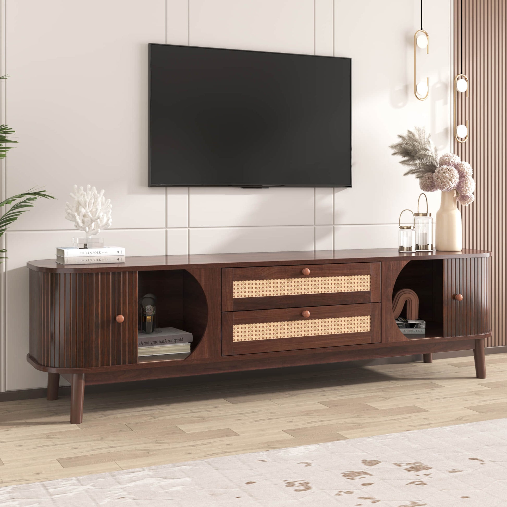 Front-angled dark brown modern tv stand with TV and decor in stylish room.