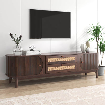 Modern tv stand wide shot in a room with TV and decor items.