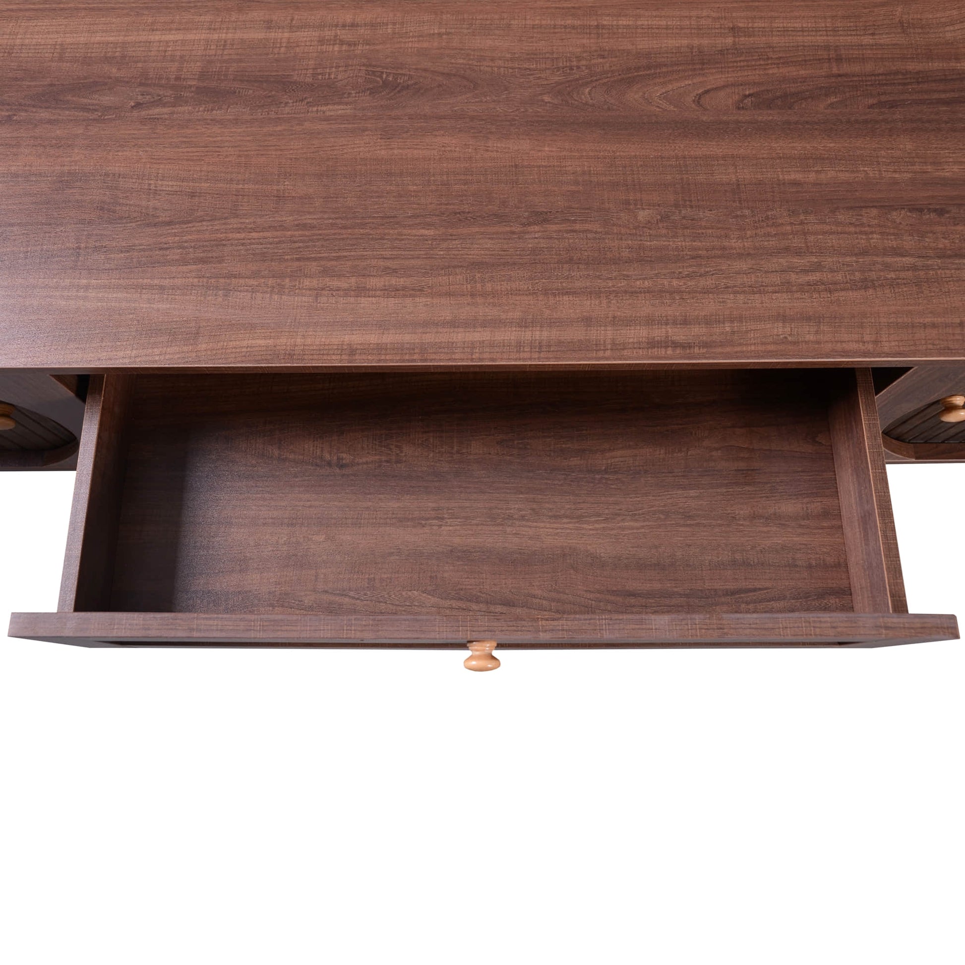 Overhead close up of an open drawer in a dark wood stand for the tv.