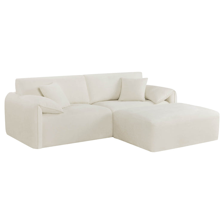 The Winsley 3-Seat Sofa with Ottoman is a plush, beige L-shaped couch featuring soft cushions and a modern design.