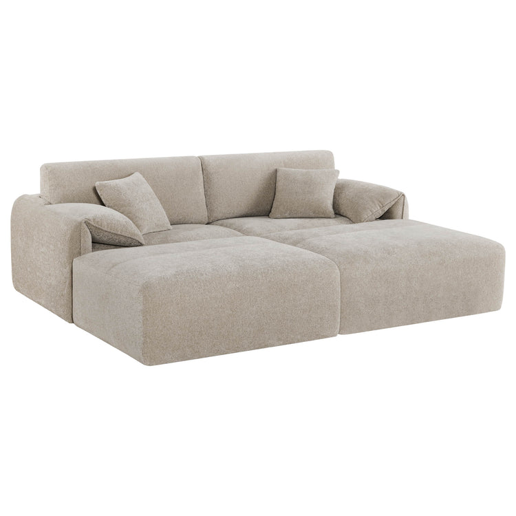 The Winsley 3-Seat Sofa with Ottoman features a cozy beige fabric, plush cushions, and a modern L-shaped design.