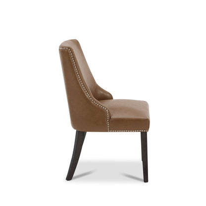 Asher dining chair with brown upholstery and silver nailhead accents from the side - CHITA Living