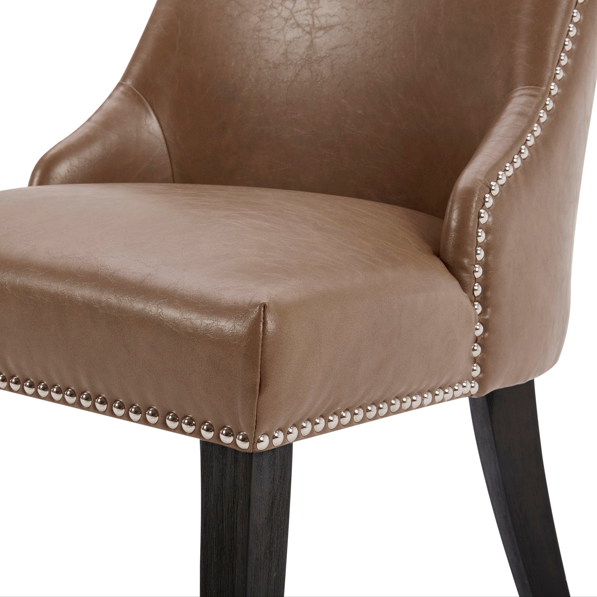 Close-up of Asher dining chair's brown upholstery with silver nailhead trim - CHITA Living