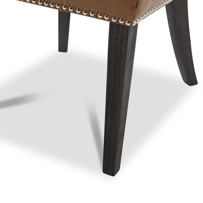 Tapered leg and nailhead trim detail of Asher dining chair in brown upholstery - CHITA Living