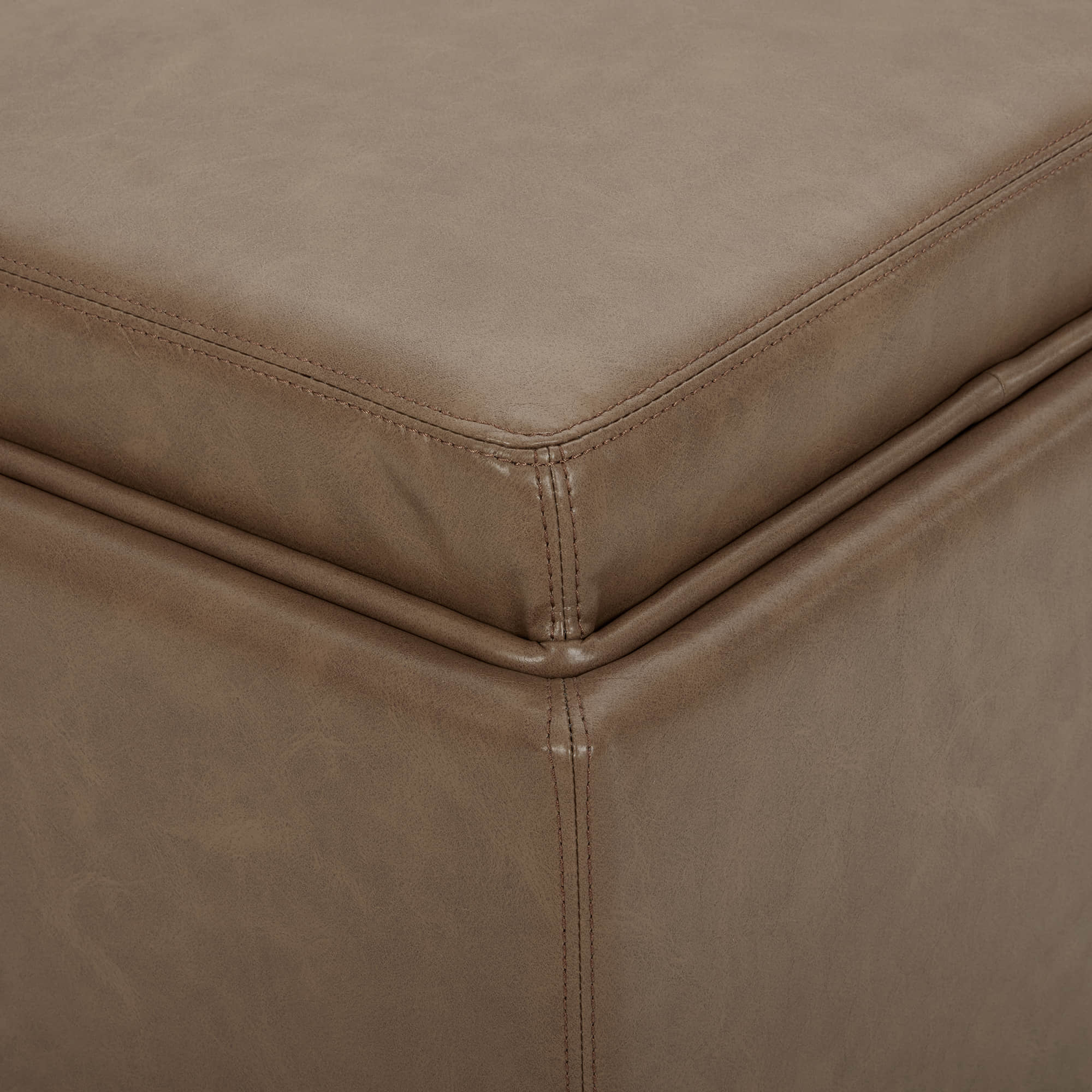 Brown faux leather cube storage ottoman with soft lid and stitching details - CHITA Living