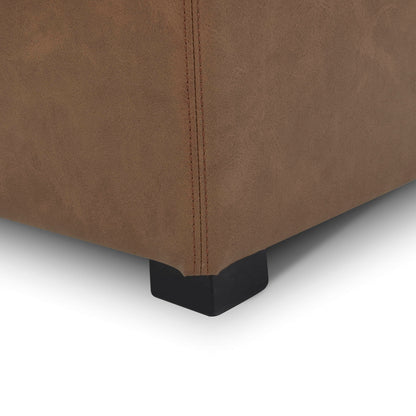 Close-up of brown faux leather cube storage ottoman corner with black leg - CHITA Living