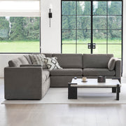 Delaney modular sofa in a bright living room with large windows and modern decor - CHITA Living