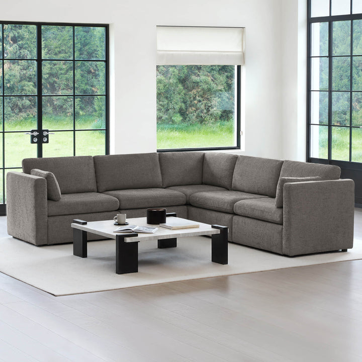 Delaney 5-Piece Corner Modular Sofa Chaise in a bright, minimalist living room with large windows - CHITA Living