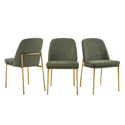 Golda Dining Chair, green fabric with gold legs, three chairs in a row with one facing backward.