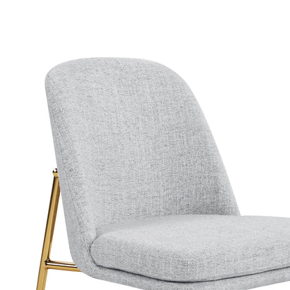 Golda Dining Chair, light gray fabric with gold legs, close-up of backrest and seat.