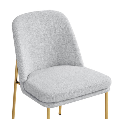 Golda Dining Chair, light gray fabric with gold legs, close-up of seat and backrest.