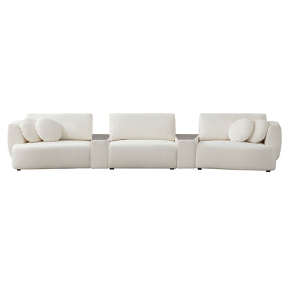 Grace curved sofa in light boucle fabric with round cushions in modern living room - CHITA Living