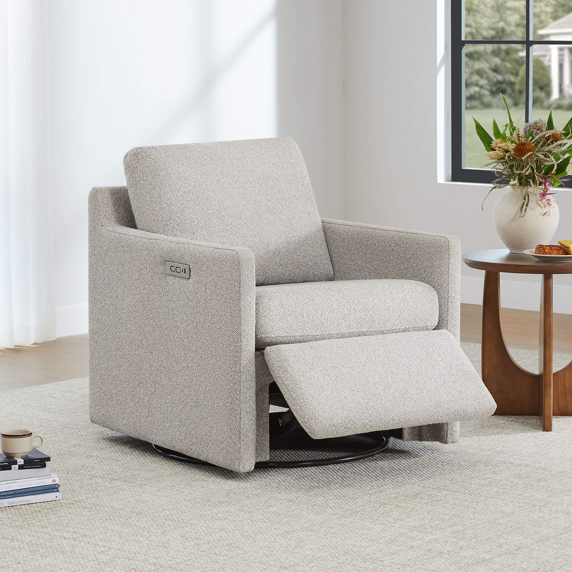 Henry Power Swivel Recliner in light beige fabric, footrest extended, living room setting.