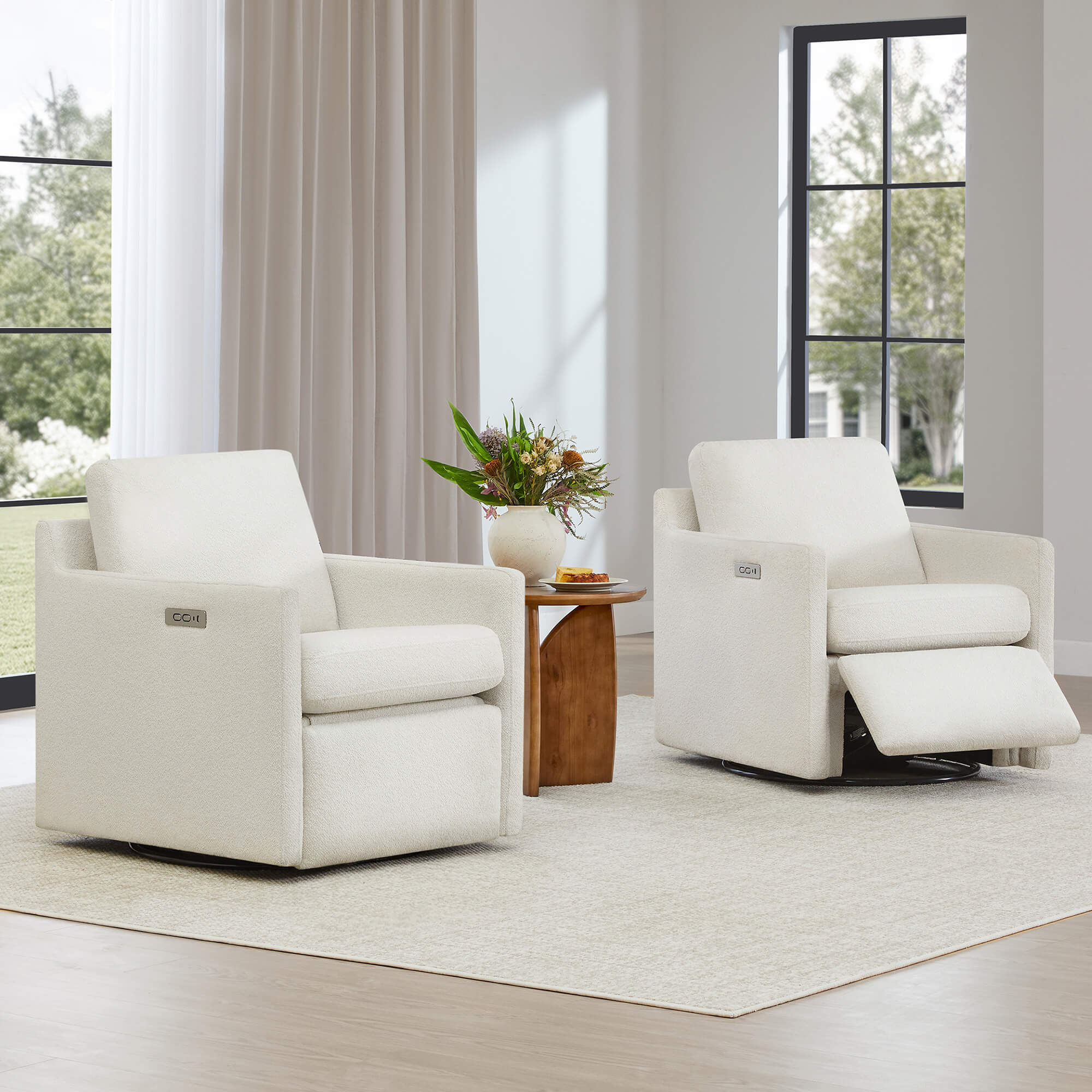 Two Henry Power Swivel Recliners in light beige fabric, one with footrest extended