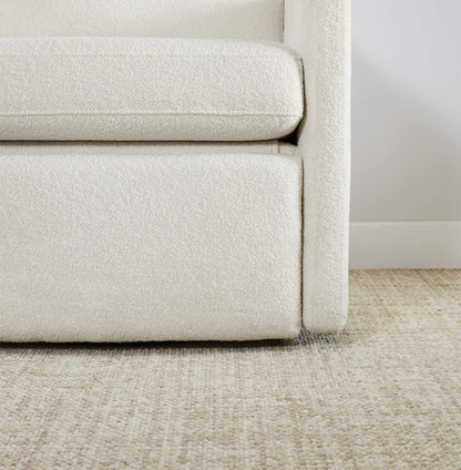 Close-up of Henry Power Swivel Recliner in light beige fabric