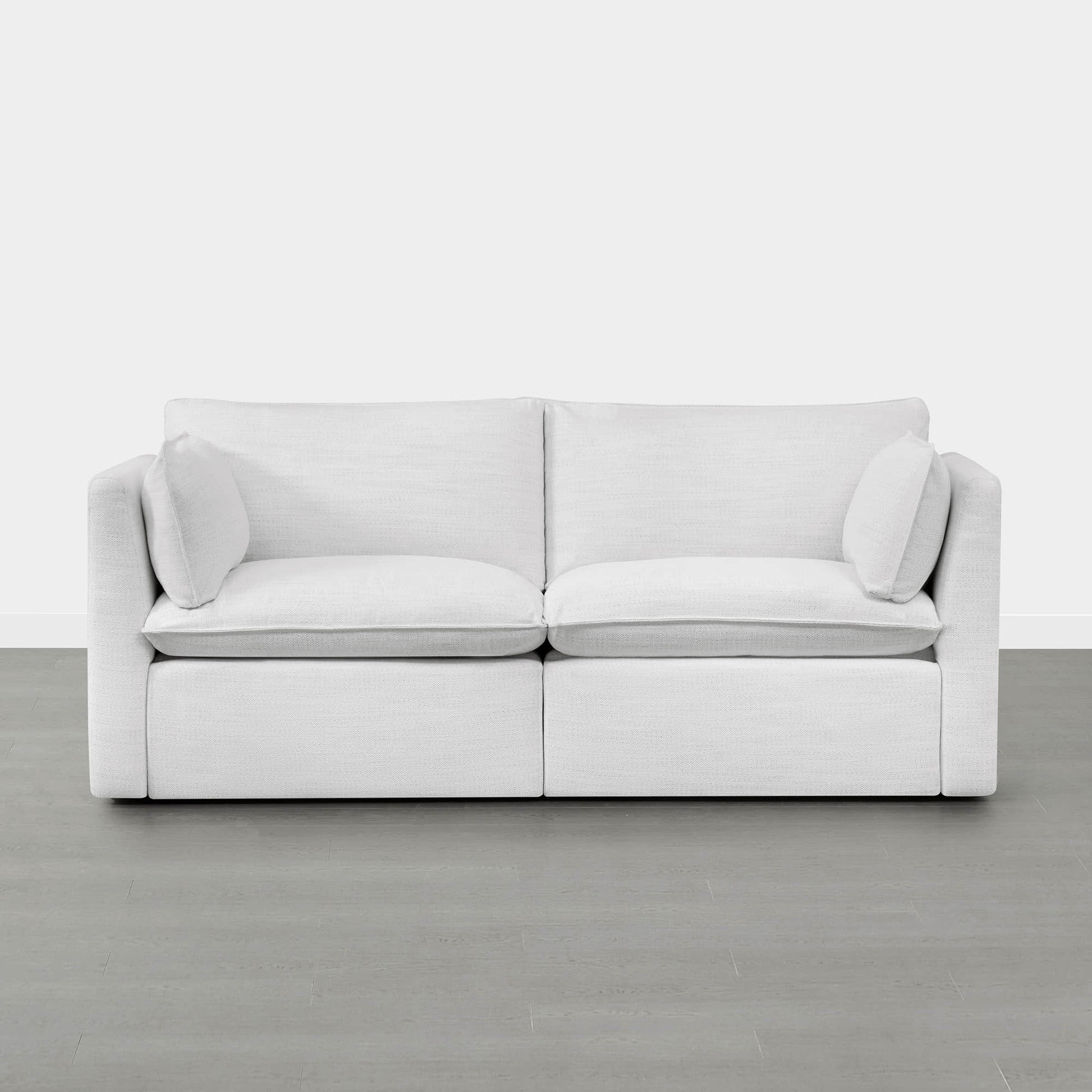 Front view of Sophia modular sofa in white with plush cushions and arm pillows - CHITA Living