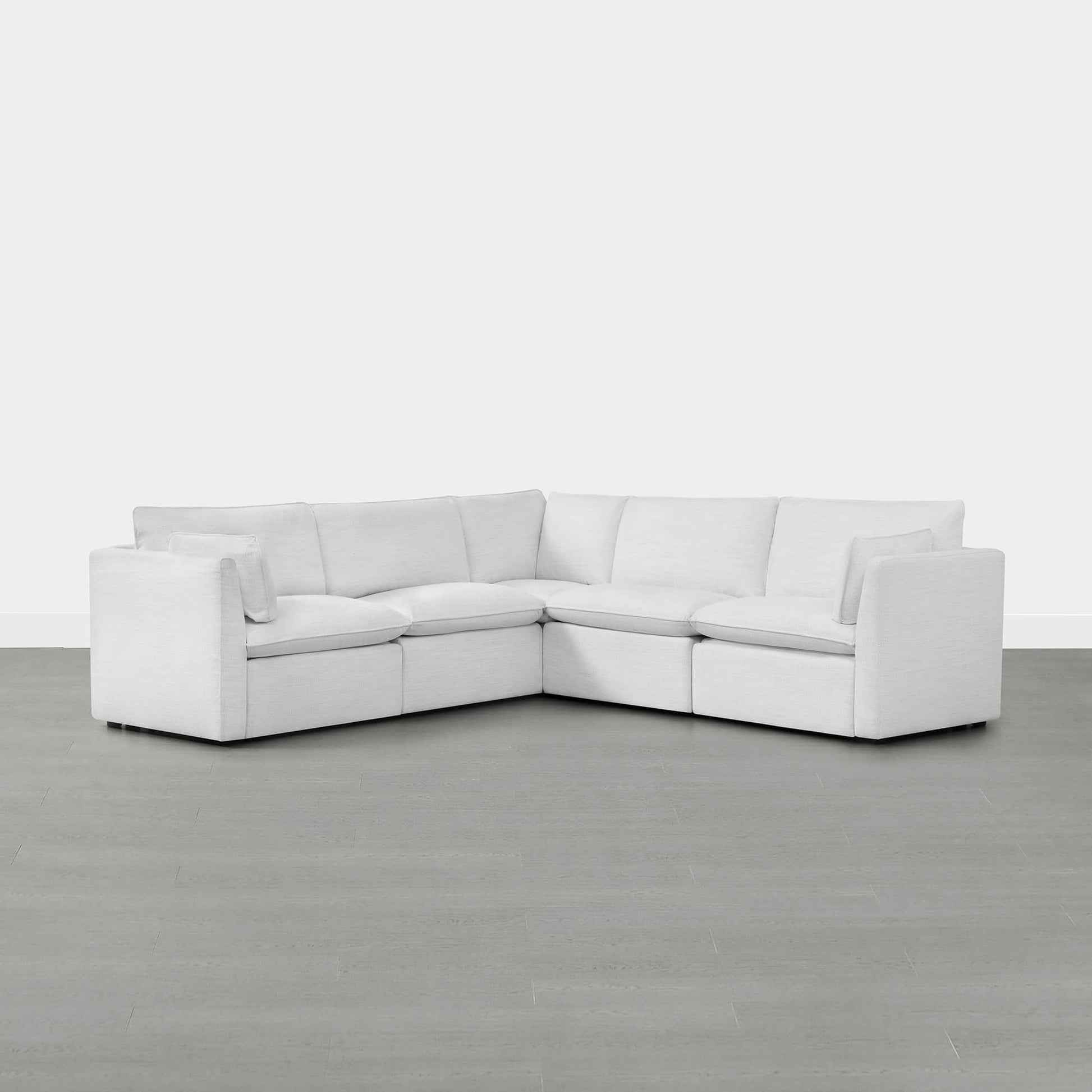 Sophia 5-piece white modular sofa in contemporary living room with light gray flooring - CHITA Living