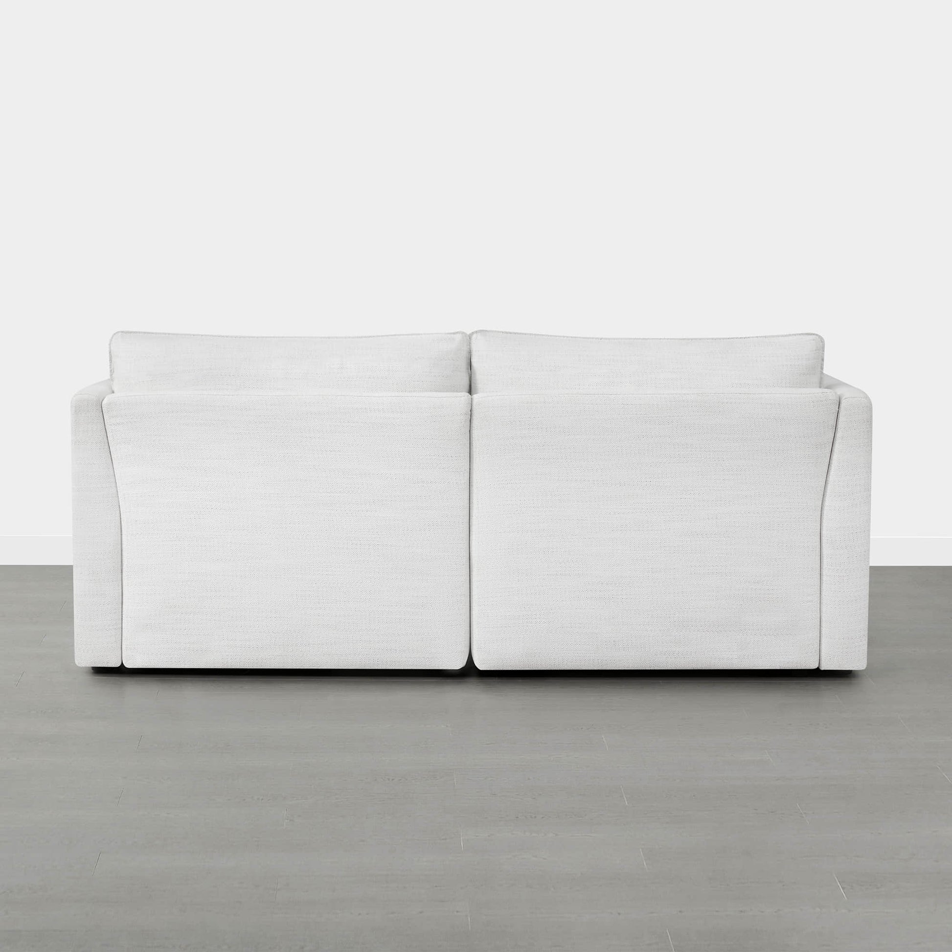 Back view of Sophia 2-piece modular sofa in white, showcasing its modern silhouette - CHITA Living