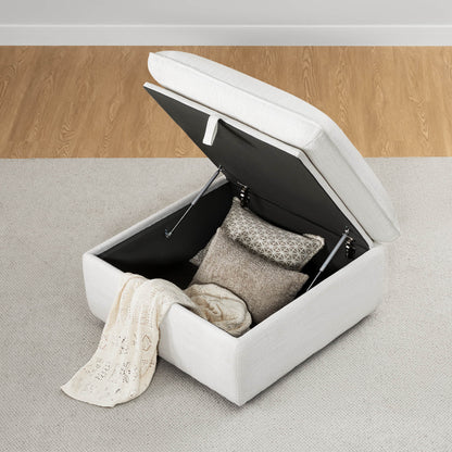 Plush ivory storage ottoman with open lid revealing blankets and cushions in a living room - CHITA Living