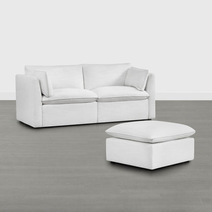 Sophia light fabric modular sofa with plush cushions and matching ottoman in modern living room - CHITA Living