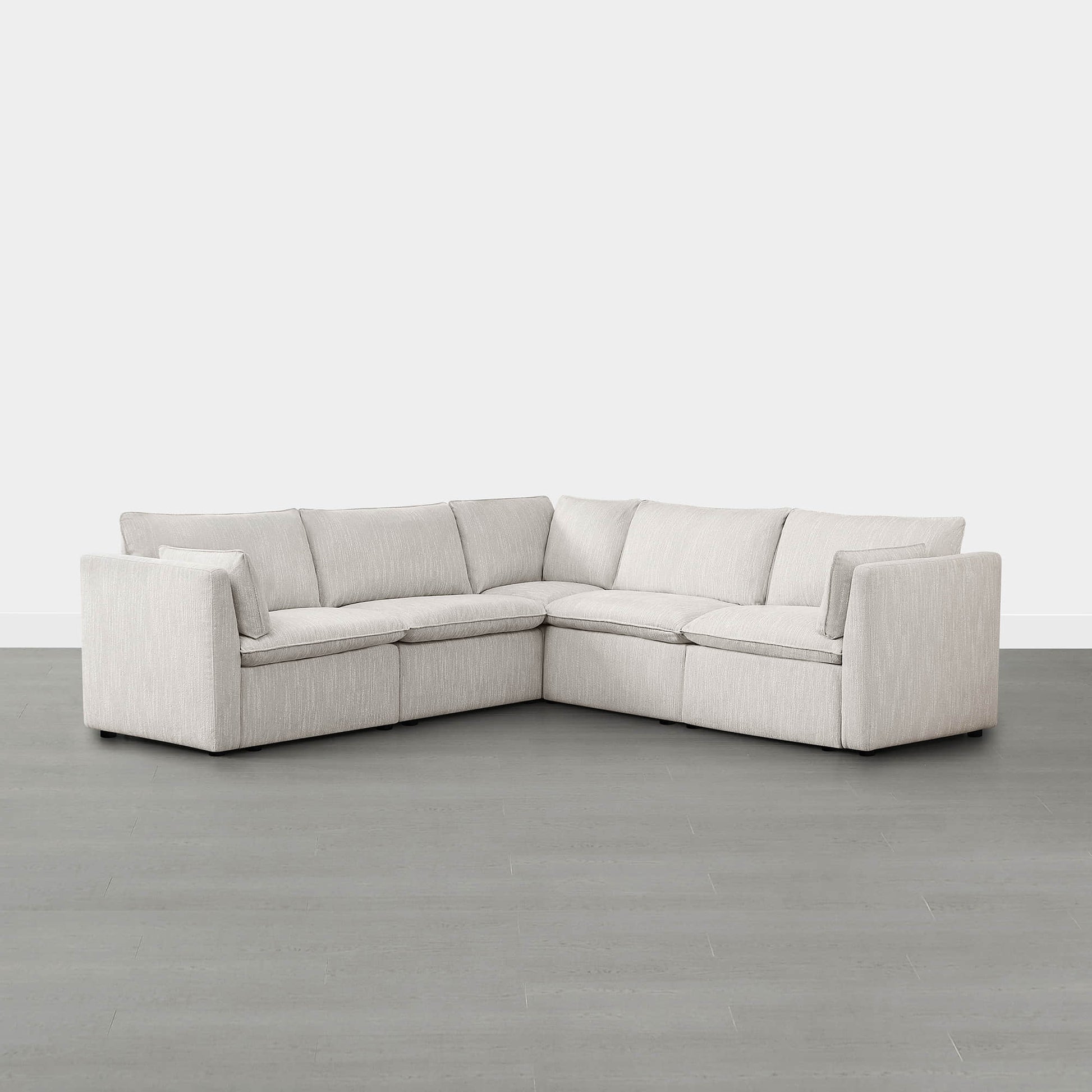 Sophia 5-piece feather modular sofa in light beige fabric in modern minimalist living room.