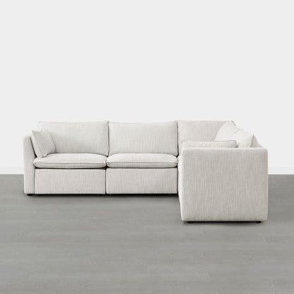 Sophia 5-piece feather modular sofa in light beige fabric against a minimalist gray backdrop - CHITA Living