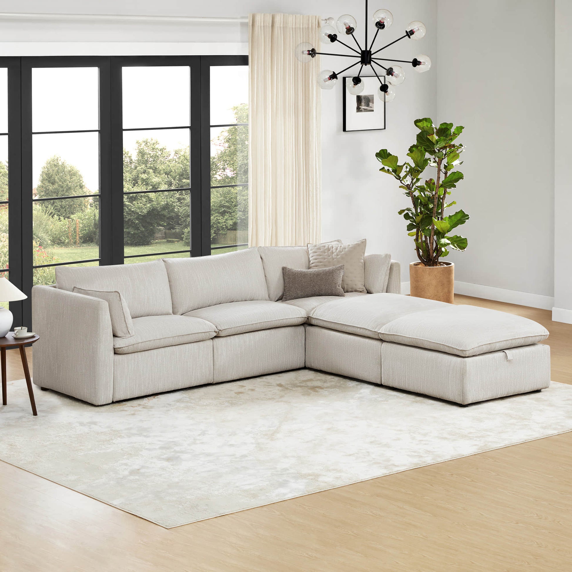 Sophia 5-piece feather modular sofa with light beige cushions in bright room.