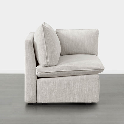 Sophia modular corner seat in light fabric showcasing plush, supportive cushions - CHITA Living