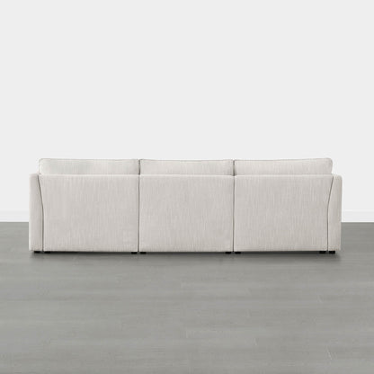 Back view of Sophia 3-piece modular sofa in light fabric on gray floor - CHITA Living