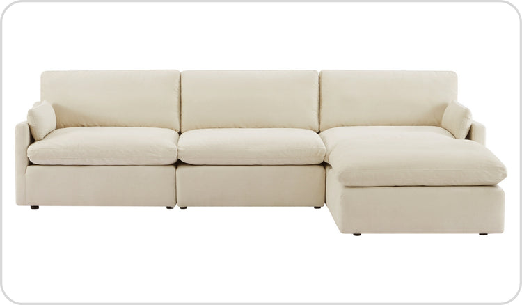 A beige L-shaped sectional sofa with plush cushions and black legs.