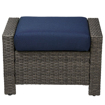 Calum Rattan outdoor ottoman with navy cushion for stylish patio relaxation - CHITA Living