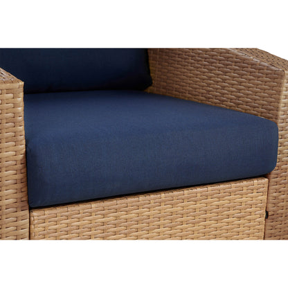 Calum Rattan chair featuring navy cushion and textured rattan weave for outdoor comfort - CHITA Living