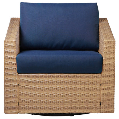 Calum Rattan outdoor chair with navy cushion, designed for stylish comfort - CHITA Living