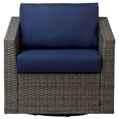 Calum Rattan outdoor swivel chair with navy cushion and textured rattan weave - CHITA Living