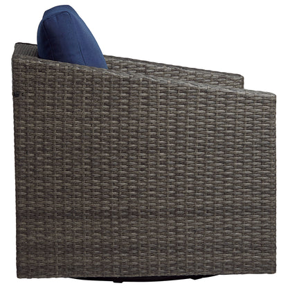 Calum Rattan outdoor chair with thick navy cushion, perfect for stylish patio comfort - CHITA Living