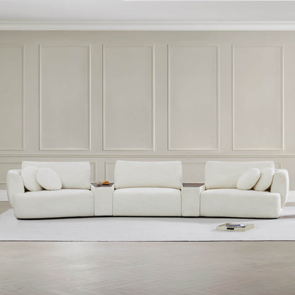 Grace 3-Seat Modular Curved Sofa in light fabric with round cushions in modern living room.